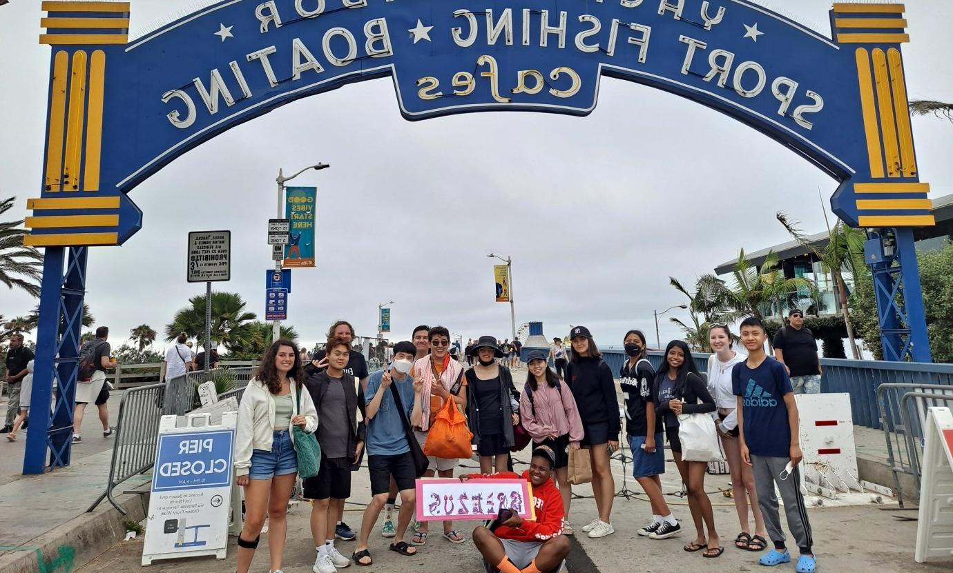 students standing in front of Santa Monica pier